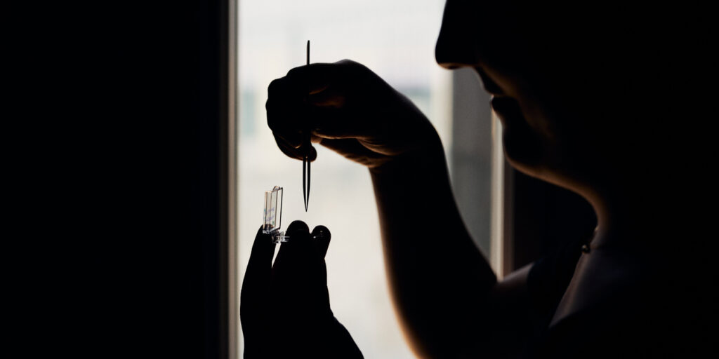 Scientist holds sample in her hand