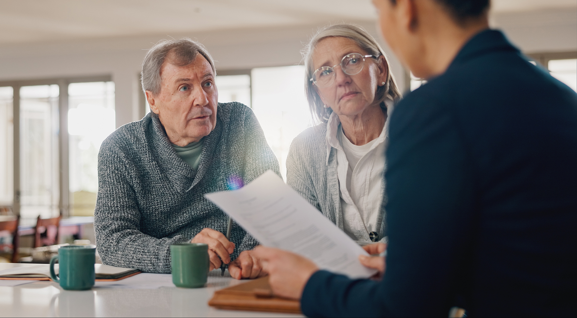 Conversation, documents and senior couple with financial advisor for retirement annuity saving account. Meeting, finance paperwork and elderly man and woman with investment banker for pension growth.